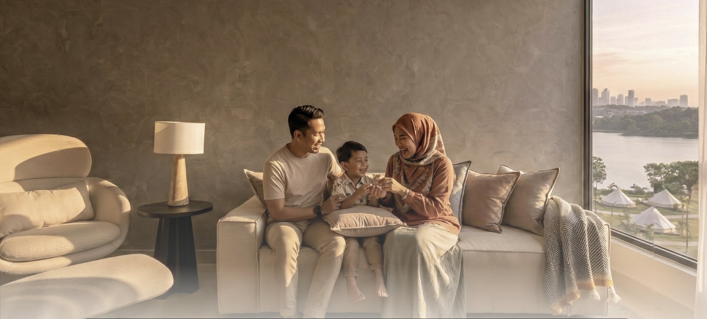 A family together on the sofa of an Astra2 living room with a lake view